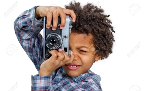 53049692-black-boy-learns-to-shoot-at-the-camera